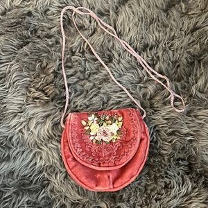 Small pink velvet crossbody with flowers embroidered on front